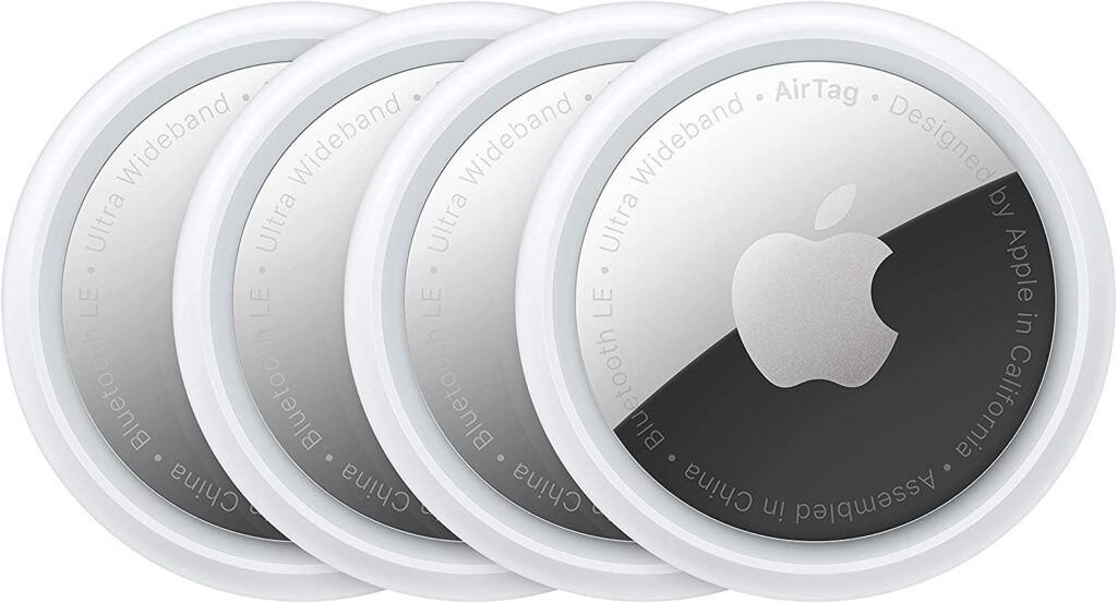 Four circular Apple AirTags.