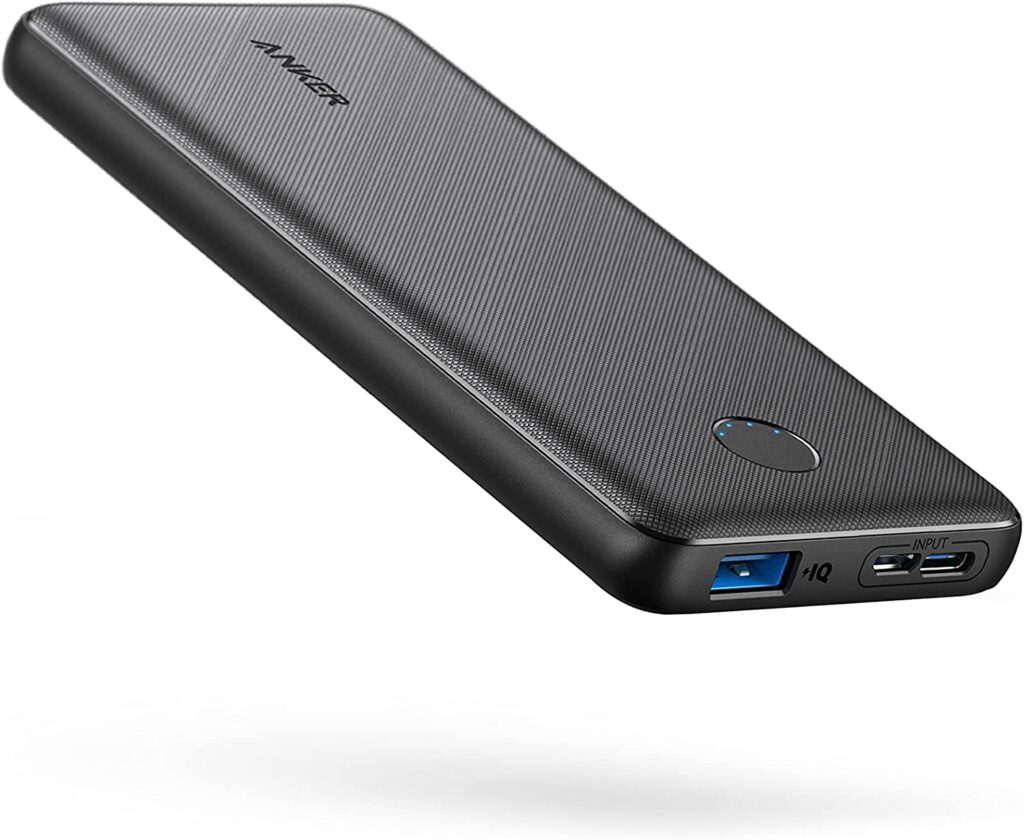 A black portable charger used to charge an iphone.