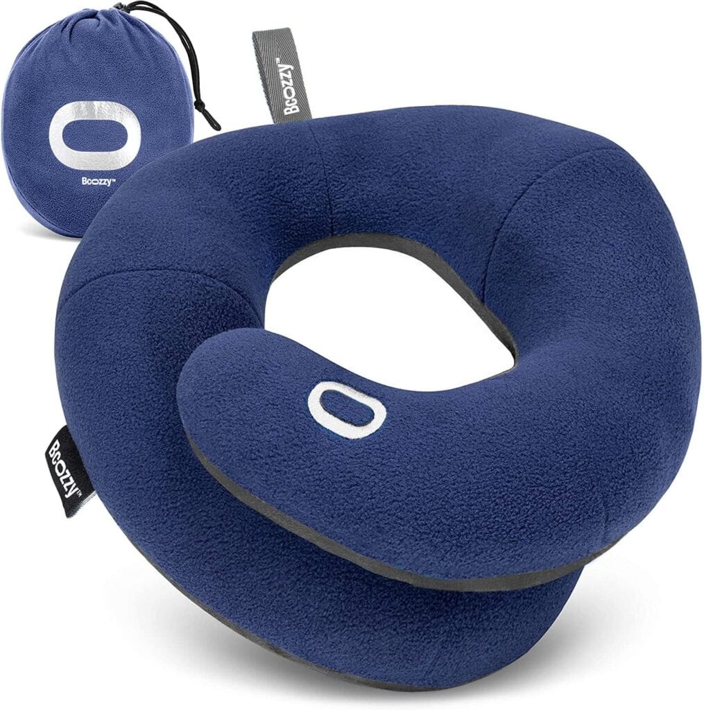 A blue travel pillow with a carrying case.