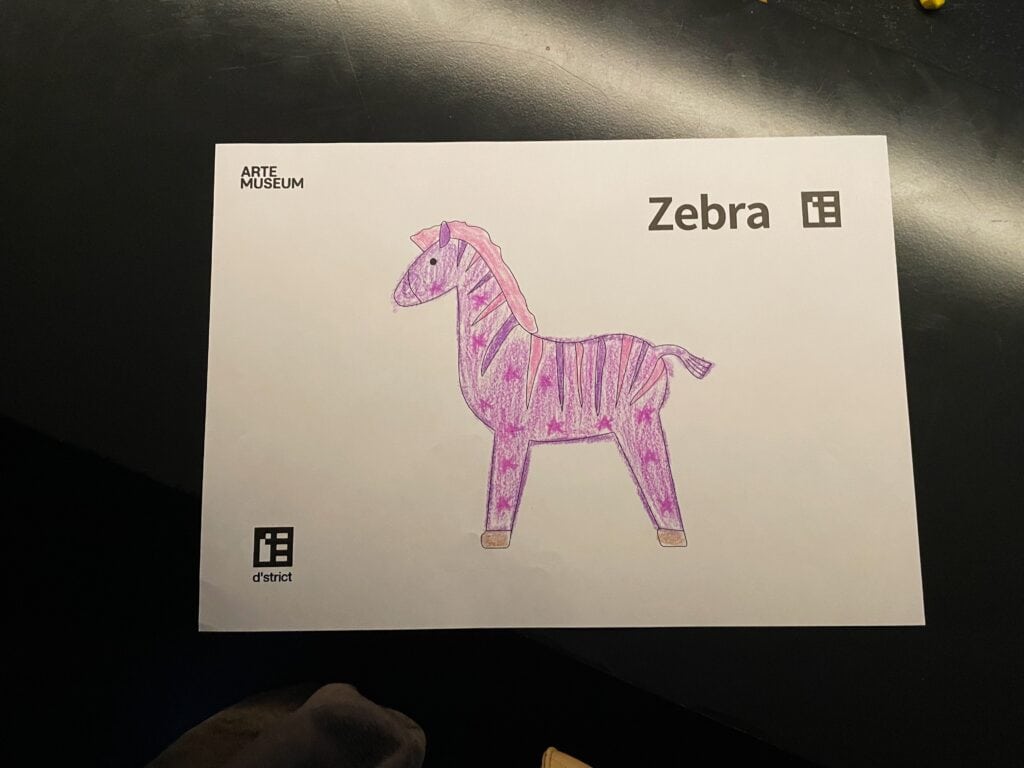 A zebra colored in pink and purple at the Arte museum for the Live Sketchbook installation.