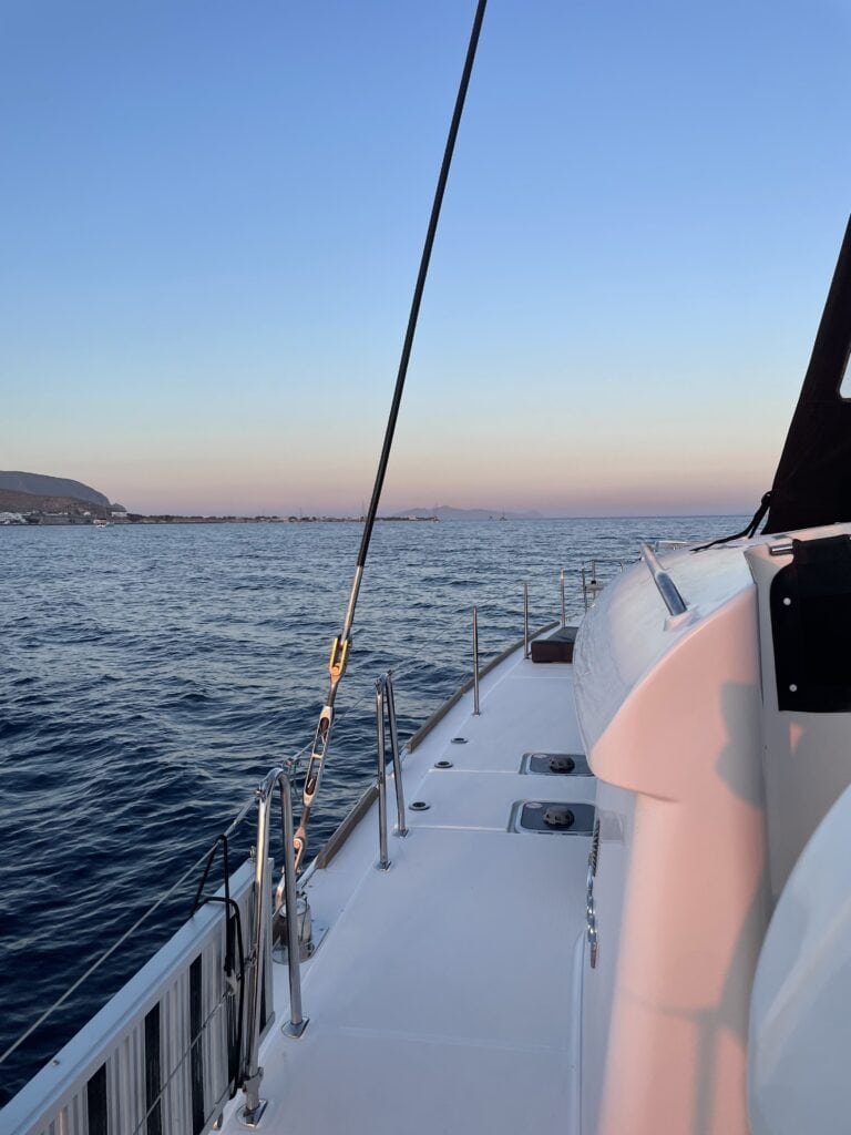 A boat sailing across the Mediterranean ocean in Santorini.