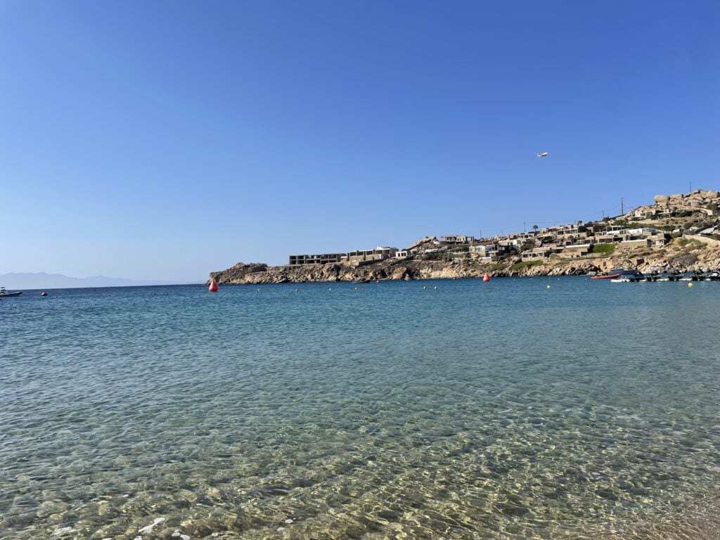 Aqua blue colored ocean water at the Paradise Beach Club in Mykonos Greece.